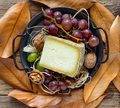 pecorino cheese with mountain hay, in autumnal background with black grapes - PhotoDune Item for Sale
