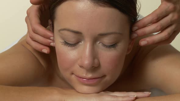 Woman having face massage