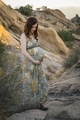 Young pregnant woman standing in a natural setting - PhotoDune Item for Sale
