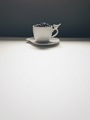 Coffee cup filled with coffee beans over a white background  - PhotoDune Item for Sale