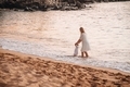 Mother and daughter walking in the waves #debb_a/motherhood, #debb_a/childhood - PhotoDune Item for Sale