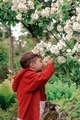 Boy smell sweet white flower in the garden  - PhotoDune Item for Sale