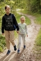 Two sisters are walking along the path in the garden. - PhotoDune Item for Sale