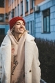 Young stylish woman in warm handknitted red hat enjoy winter sun
 - PhotoDune Item for Sale
