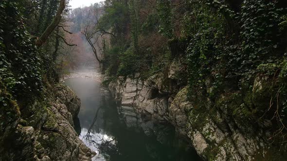 River in a Narrow Canyon with White Rocks