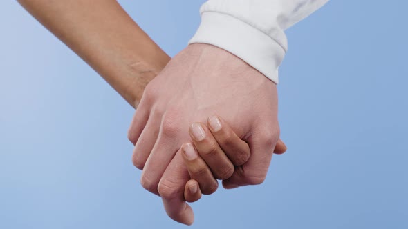 Hands of Mixed Race Woman and White Man