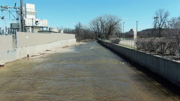 Creek with low water supply in Kaukauna Wisconsin, sunny day early spring