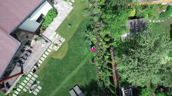 Video Footage of a Man Mowing the Lawn