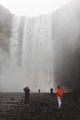 People gathered around to take in a beautiful natural waterfall in Iceland - PhotoDune Item for Sale