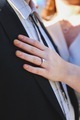 Woman’s hand on a man’s chest with engagement ring on her finger, engaged couple - PhotoDune Item for Sale