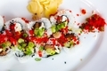 Beautiful colorful sushi closeup top down with pickled ginger, scallions and red topping - PhotoDune Item for Sale