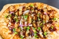 Delicious barbecue bbq drizzle chicken pizza with onions and green peppers closeup  - PhotoDune Item for Sale