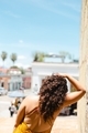 Beautiful Latina woman with curly brown hair from behind in sunny warm Oaxaca Mexico - PhotoDune Item for Sale