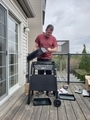 Family man assembling new gas barbecue on balcony  - PhotoDune Item for Sale