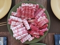 Variety of raw meats prepared for serving traditional Korean food Hot pot, thinly sliced meat rolled - PhotoDune Item for Sale