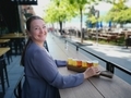 Octoberfest, Woman at the outdoor Cafe enjoying craft beer smiling to camera  - PhotoDune Item for Sale