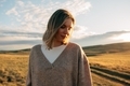 portrait of beautiful woman walking on field at sunset  - PhotoDune Item for Sale