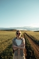 portrait of beautiful woman walking on field at sunset  - PhotoDune Item for Sale