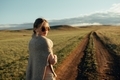 portrait of beautiful woman walking on field at sunset  - PhotoDune Item for Sale