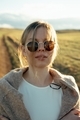 portrait of beautiful woman walking on field at sunset  - PhotoDune Item for Sale