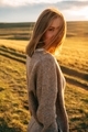 portrait of beautiful woman walking on field at sunset  - PhotoDune Item for Sale