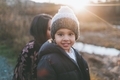 A young Indian boy smiling on a cold day at sunset.  - PhotoDune Item for Sale
