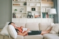 A new mom asleep on the couch with her newborn baby.  - PhotoDune Item for Sale