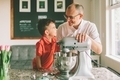 A father and son baking together with a stand up mixer in the kitchen.  - PhotoDune Item for Sale