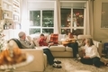 A happy family gathered around on Christmas, playing music.  - PhotoDune Item for Sale