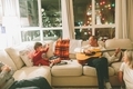 A little boy and his grandparents having fun playing music together at Christmas.  - PhotoDune Item for Sale