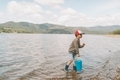 A little boy carrying a bucket out of the ocean.  - PhotoDune Item for Sale