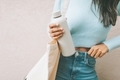 A woman holding a reusable water bottle. - PhotoDune Item for Sale