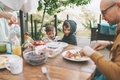 Two boys laughing while eating breakfast outside. - PhotoDune Item for Sale