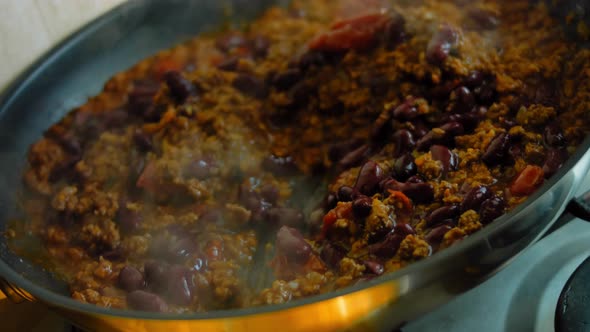 Pour the Lightly Canned Beanns Over the Chorizo Ingredients That are Frying