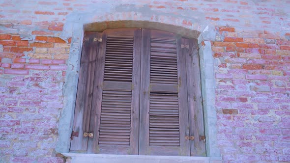 Window Closed with Shutters on Abandoned Building in Burano