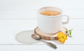 herbal tea with calendula on a white wooden table. alternative medicine  - PhotoDune Item for Sale