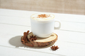 spicy latte coffee with cinnamon and anise in white mug with spice decor. - PhotoDune Item for Sale