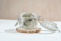 transparent glass jar with dry raspberry leaves for herbal tea. herbs for calming tea.  - PhotoDune Item for Sale