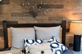 Home sweet home bedroom with reclaimed wood wall - PhotoDune Item for Sale