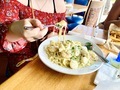 Taking a bite of chicken fettuccini Alfredo at restaurant dining out  - PhotoDune Item for Sale