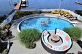 Overhead shot of backyard living space of lake living and inground swimming pool - PhotoDune Item for Sale