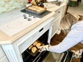 Woman in the kitchen cooking dinner for her family in oven  - PhotoDune Item for Sale