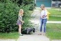 Sisters taking dog outside to go potty  - PhotoDune Item for Sale