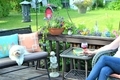 Woman enjoying a glass of wine on her backyard deck - PhotoDune Item for Sale