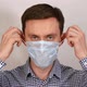 Young Man Puts on Medical Mask - VideoHive Item for Sale