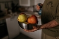 young man holding fruits, apples and pears in his hands - PhotoDune Item for Sale