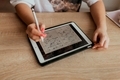 young woman solves geometry examples on a tablet - PhotoDune Item for Sale