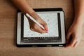 young woman solves geometry examples on a tablet - PhotoDune Item for Sale