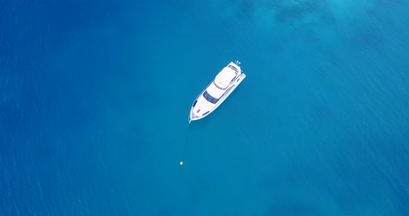 Tropical fly over abstract view of a paradise sunny white sand beach and turquoise sea background in