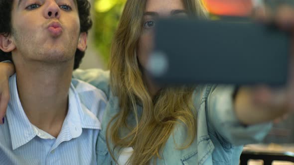 Young couple posing for selfie